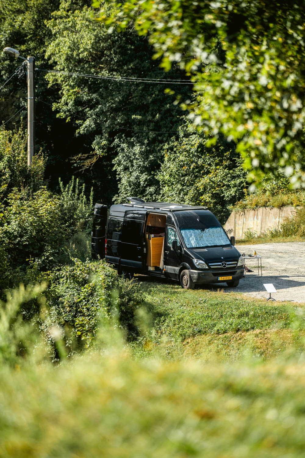 a van is parked on the side of the road