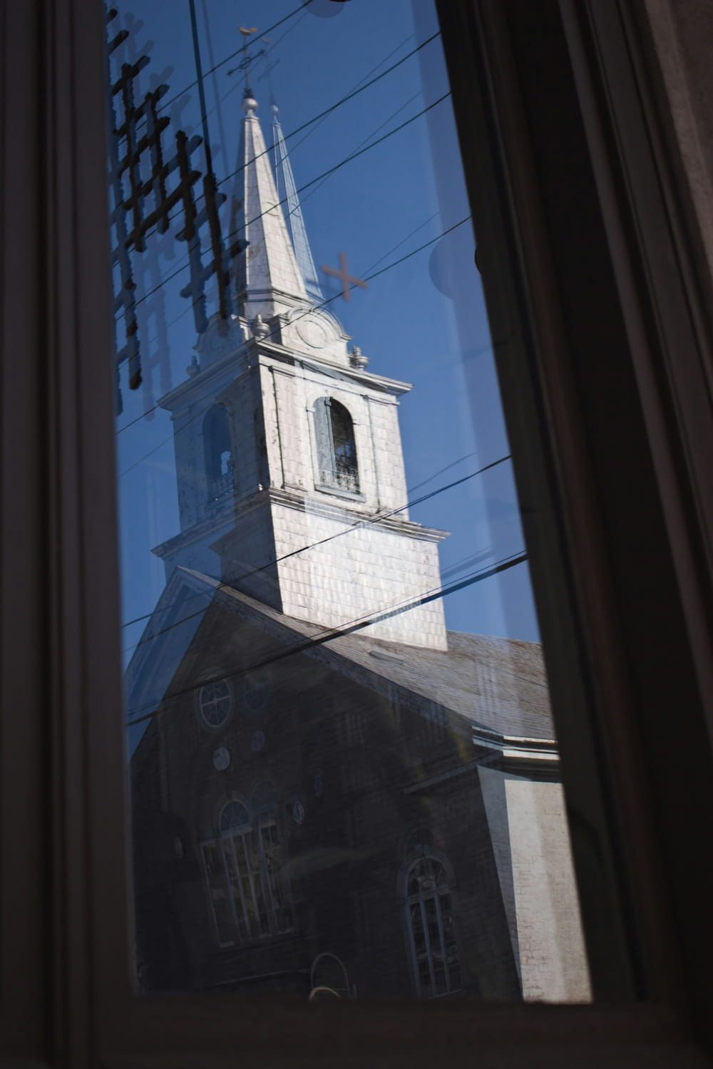 a reflection of a church in a window