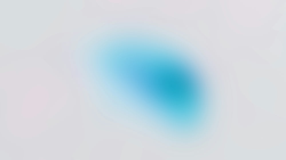 a blurry image of a blue circle on a white background