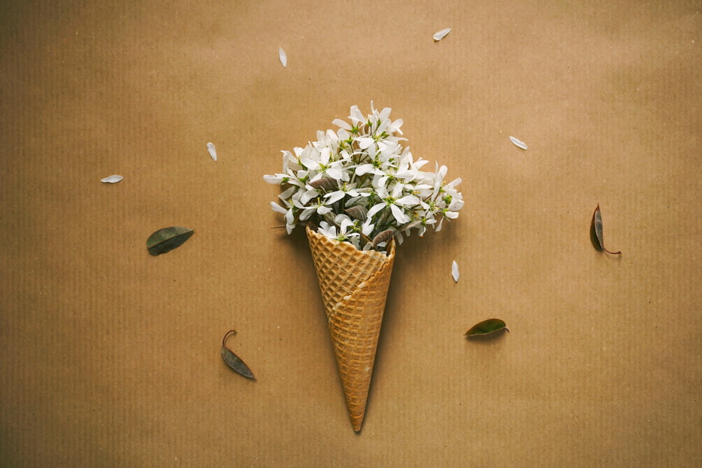 a cone with a bunch of flowers inside of it