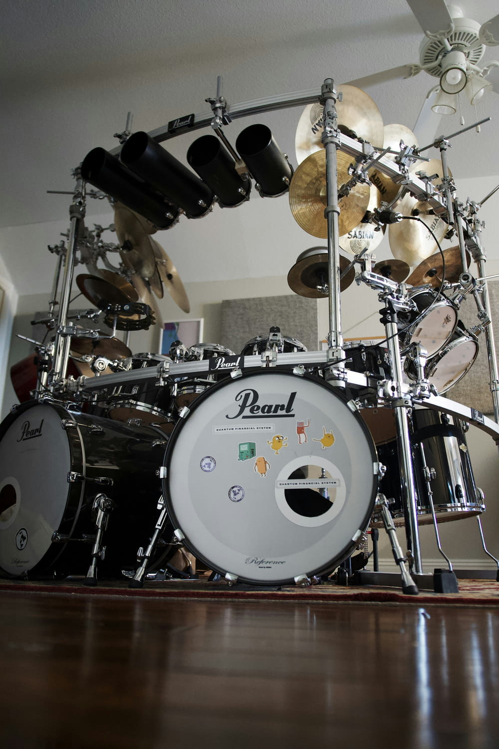 a drum kit sitting on top of a hard wood floor