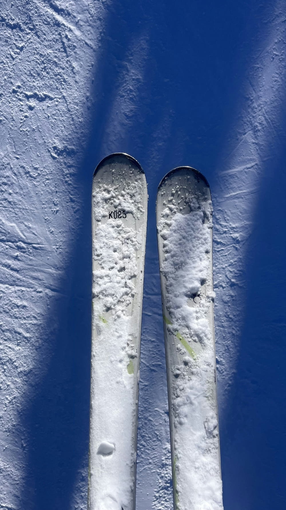 a pair of skis sticking out of the snow