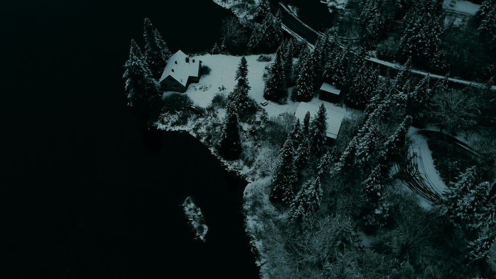 an aerial view of a house in the snow