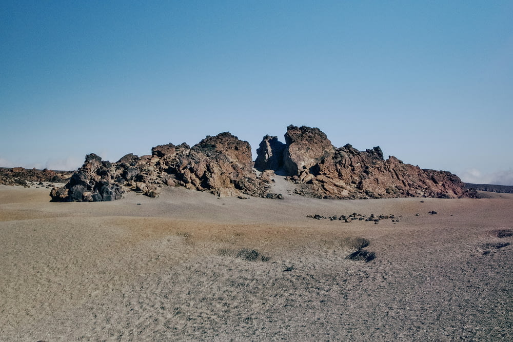 a group of rocks in the middle of a desert