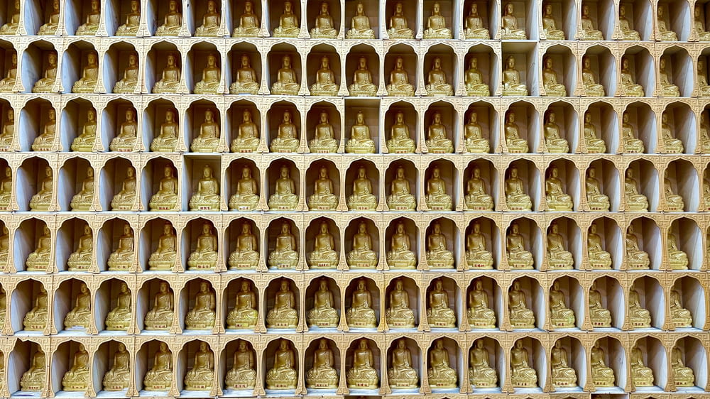 a bunch of bells that are on a wall
