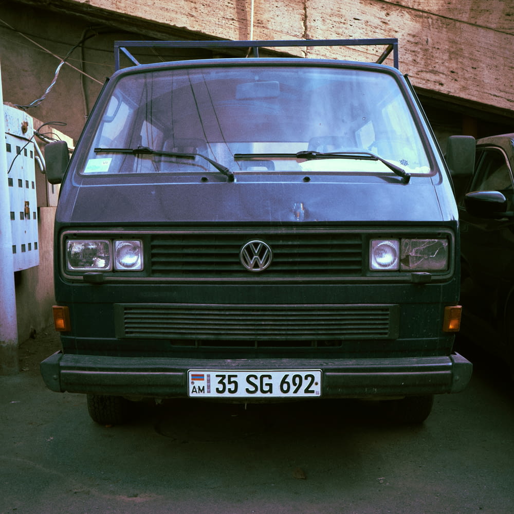 a black van parked in front of a building