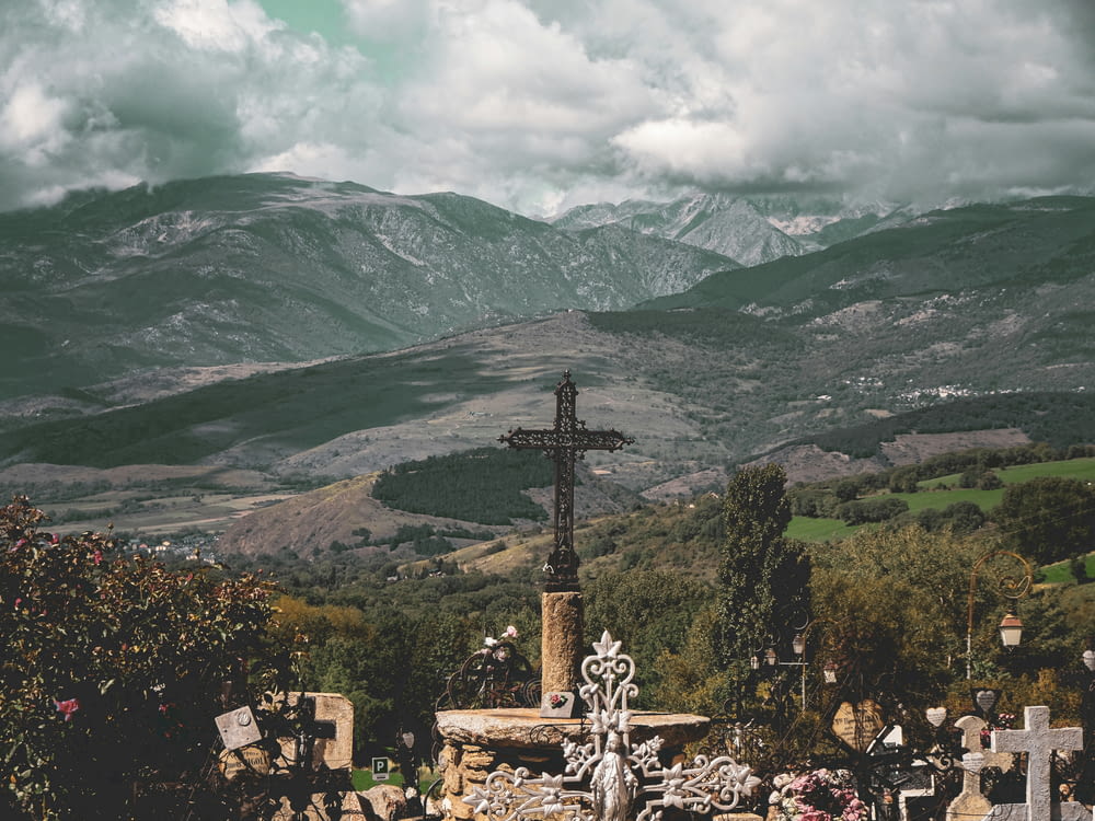 a cemetery with a cross in the middle of it