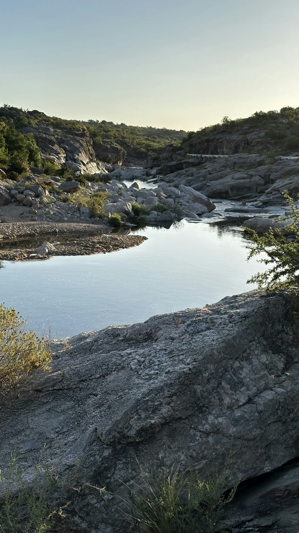 a large body of water surrounded by rocky terrain