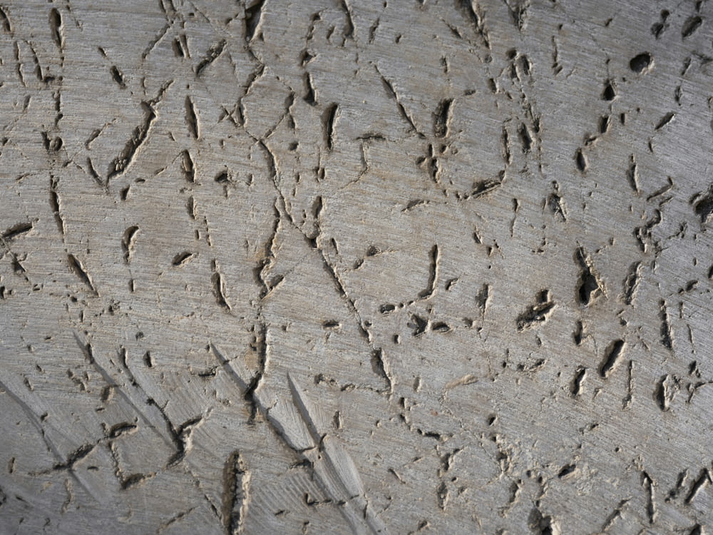 a close up of a wooden surface with cracks