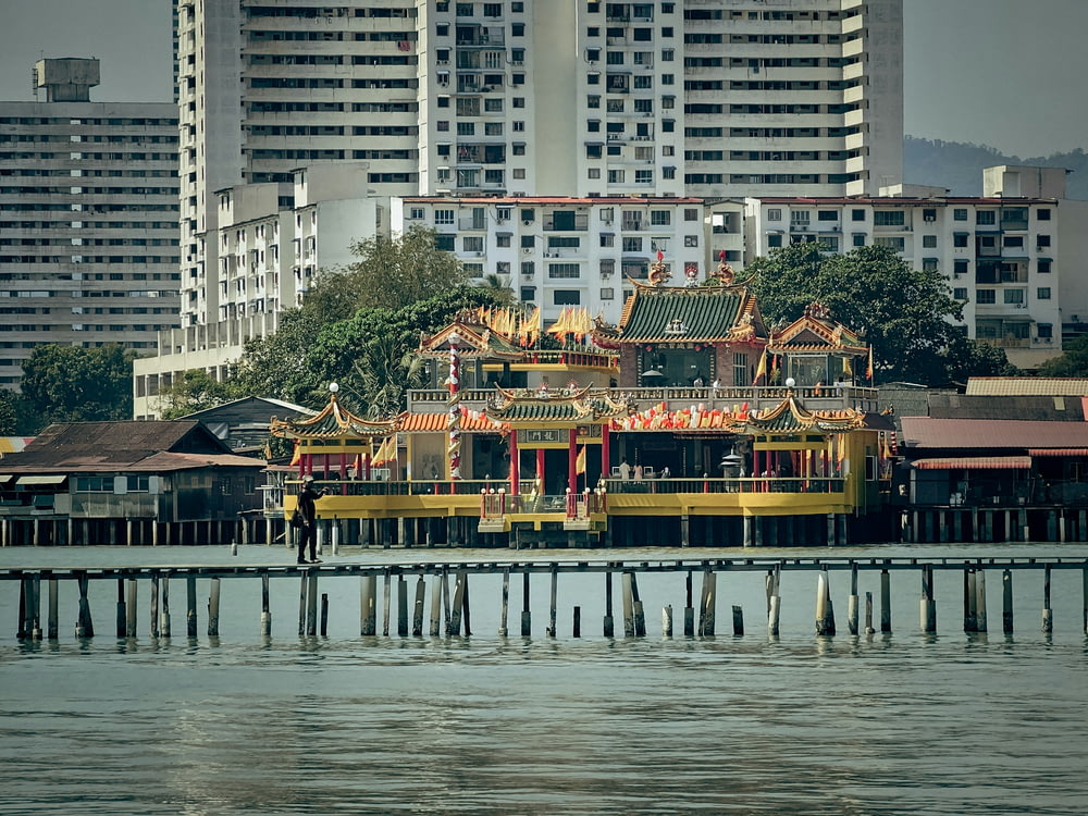 a pier with some buildings in the background