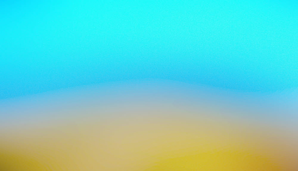 a blurry photo of a yellow and blue sky