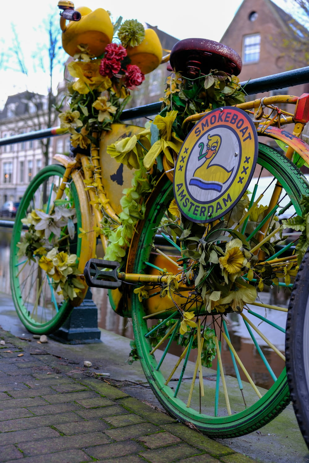 a bicycle decorated with flowers on a city street