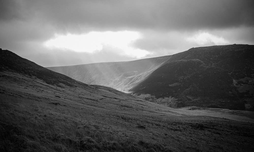 a black and white photo of a valley