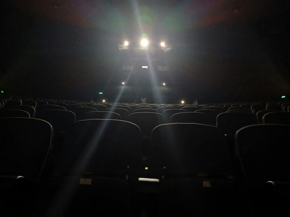 an empty theater with the lights on