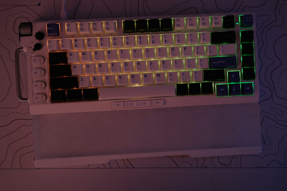 a computer keyboard with glowing keys on it