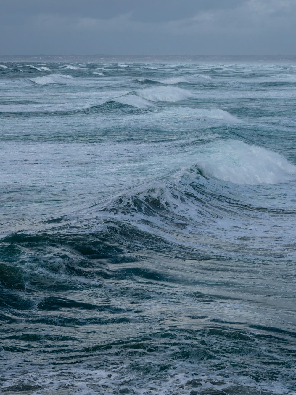 a large body of water with waves coming in