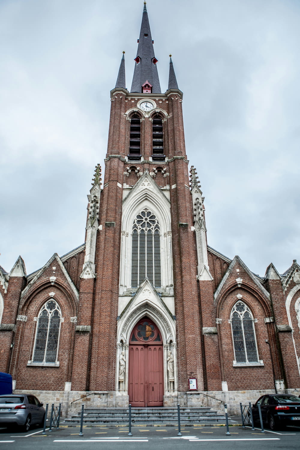 a large church with a red door and steeple