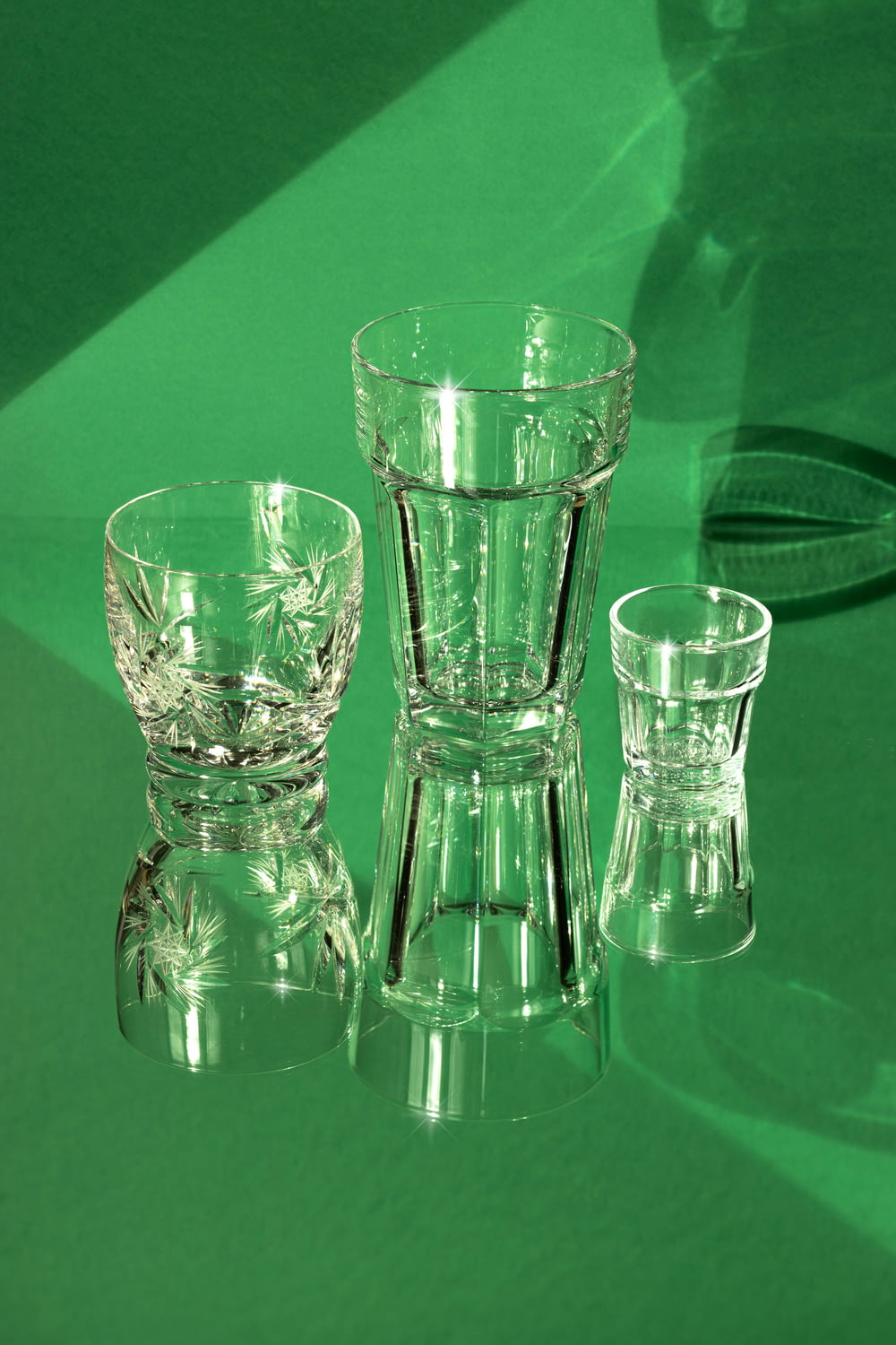 three glass vases sitting on top of a table