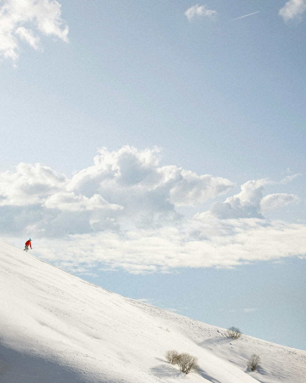 a person is skiing down a snowy hill