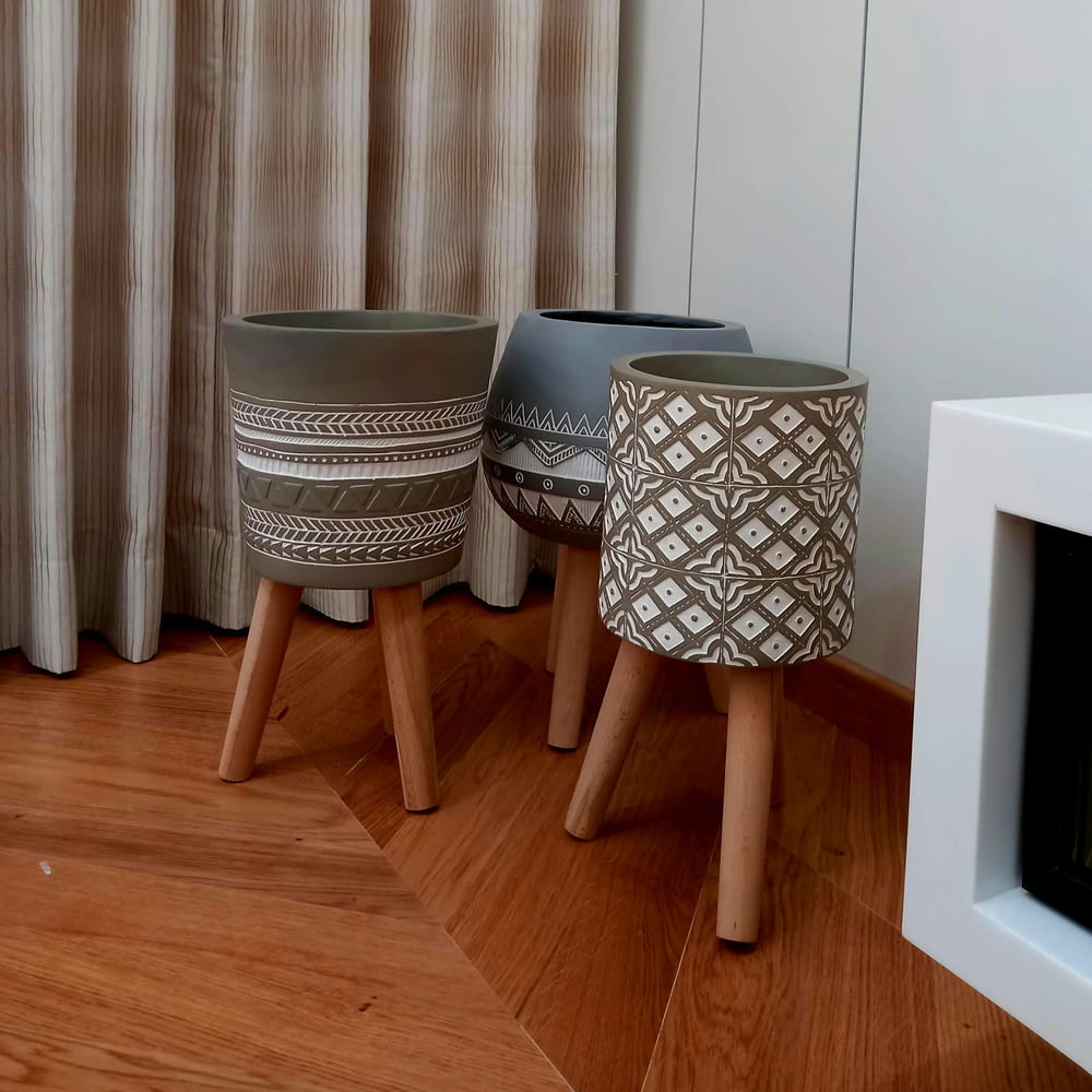 a couple of stools sitting on top of a hard wood floor