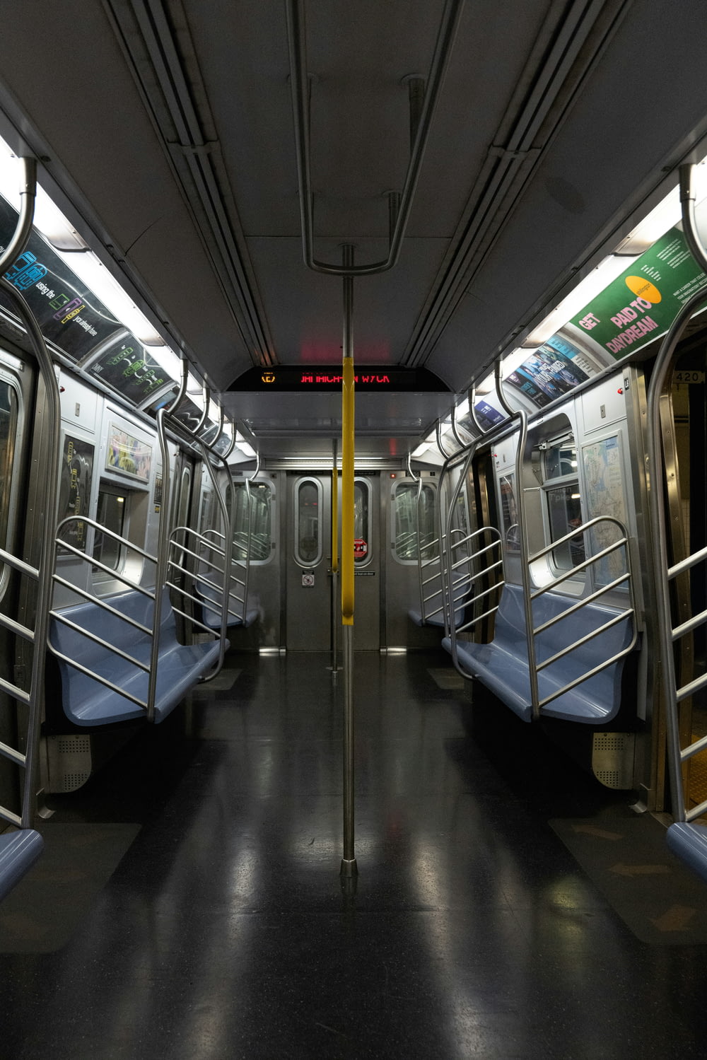 a subway car with its doors open on a dark day