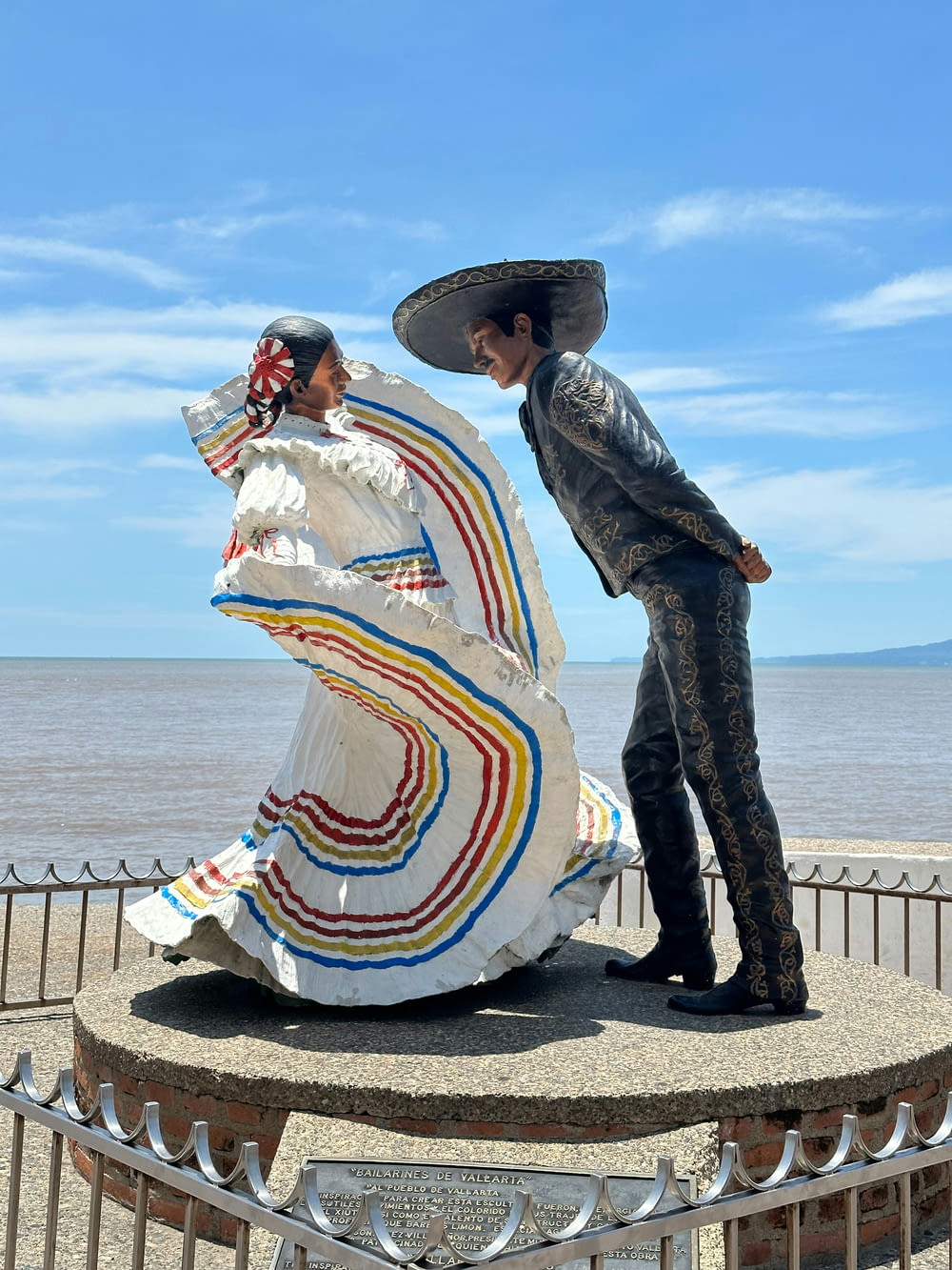 a statue of a man and a woman with a mexican hat