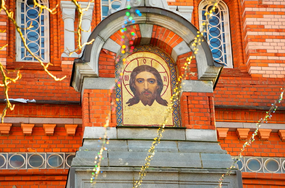 a picture of jesus on the side of a building