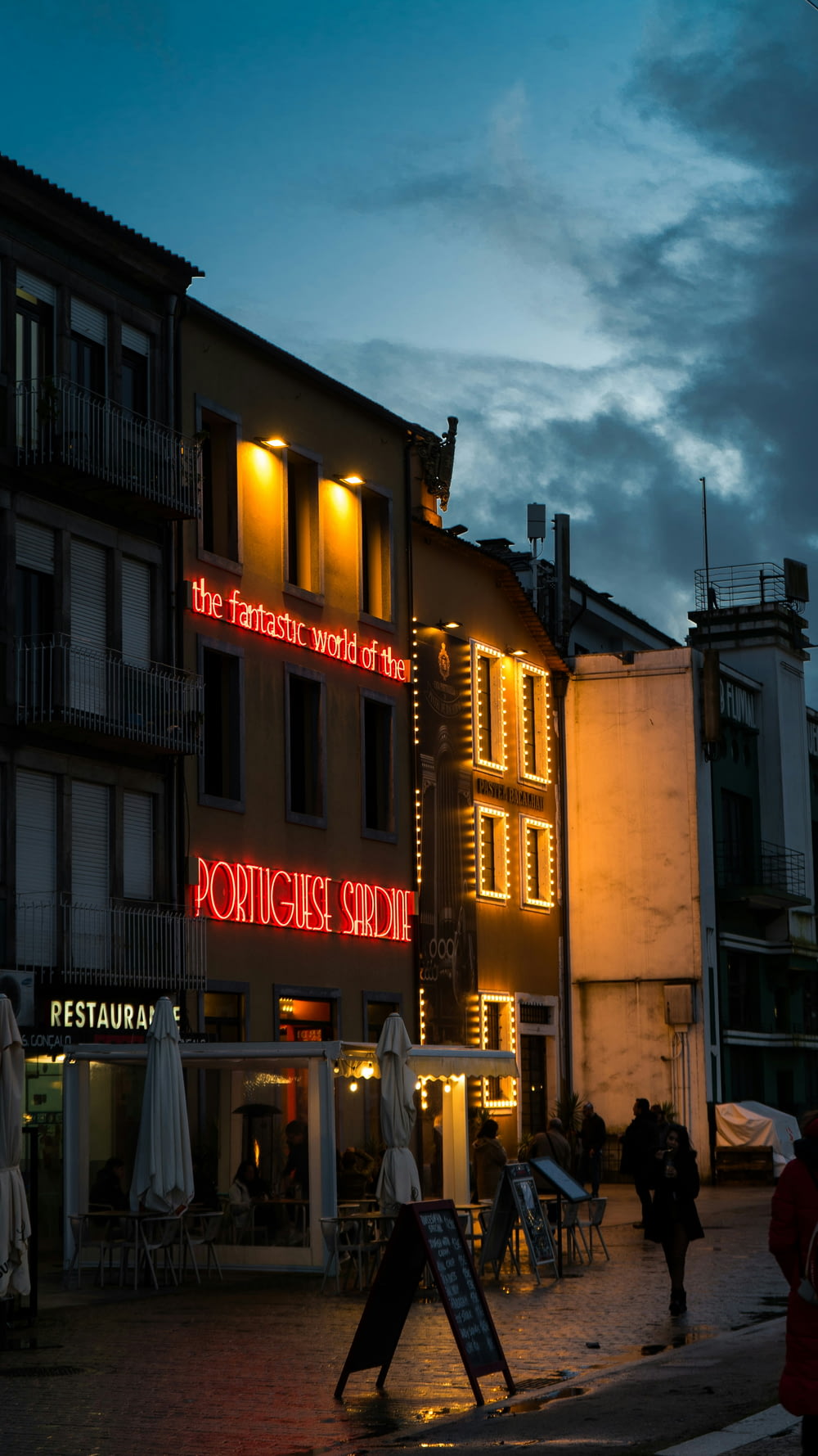 a building with a neon sign on the side of it
