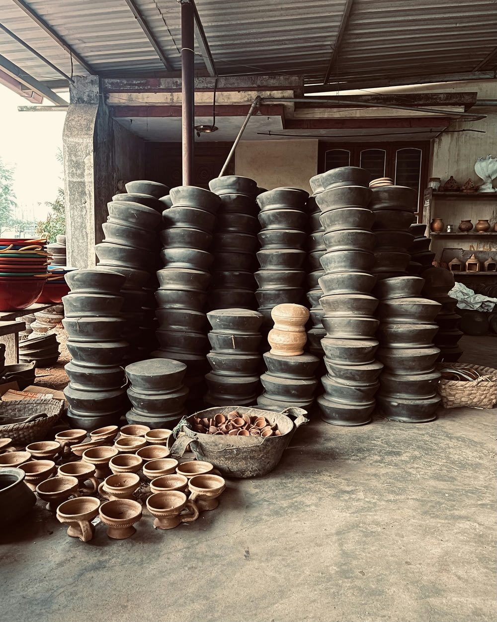 a room filled with lots of pots and bowls
