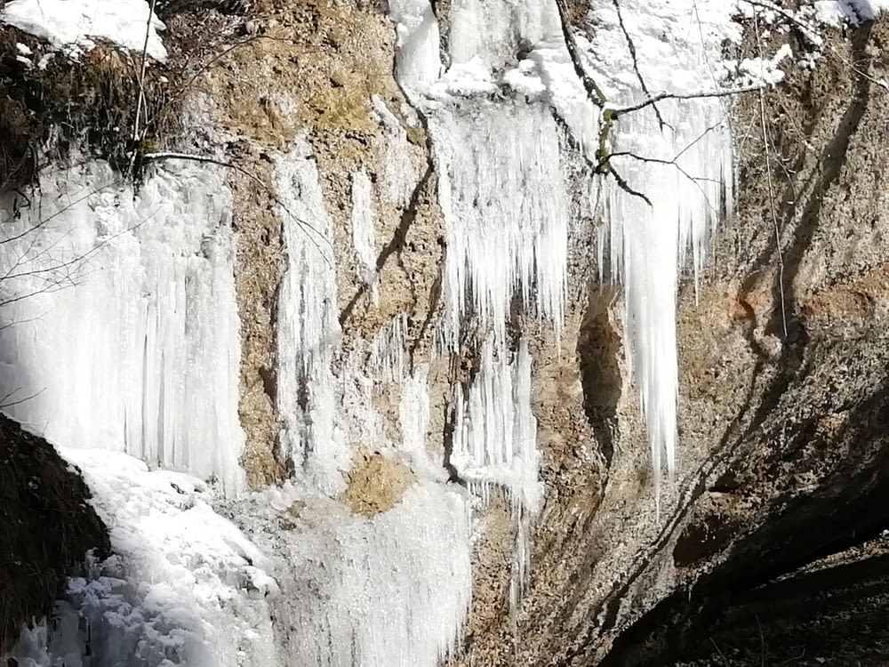 a waterfall with icicles hanging off of it's sides