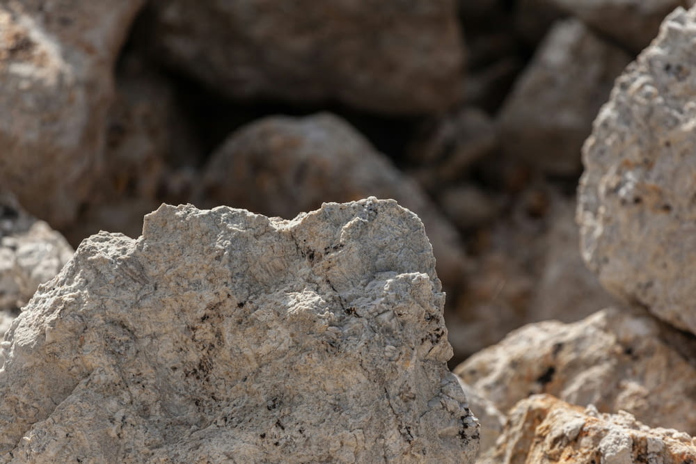 a close up of a rock formation with rocks in the background
