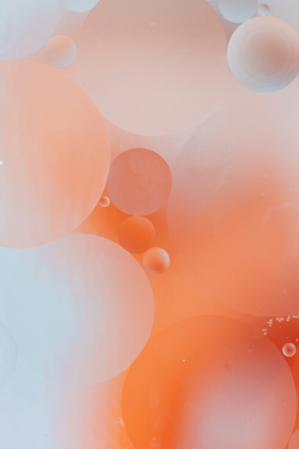 an orange and white background with bubbles