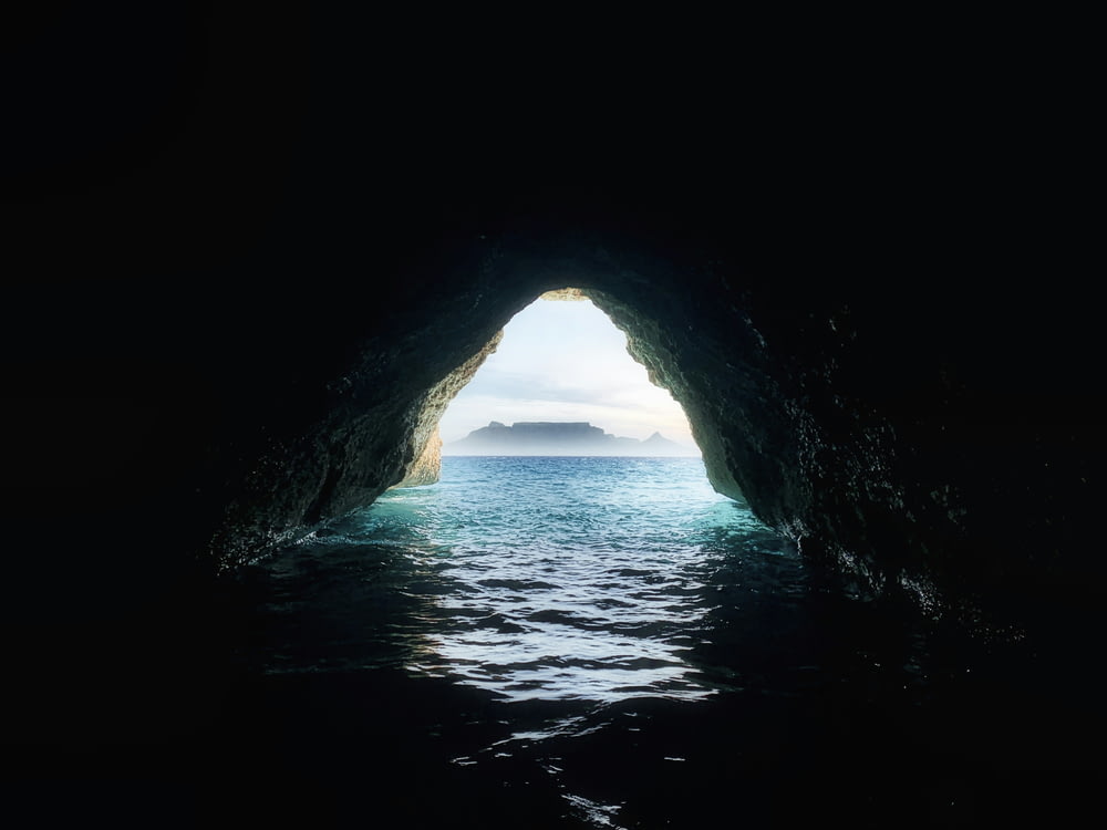 a view of the ocean from inside a cave