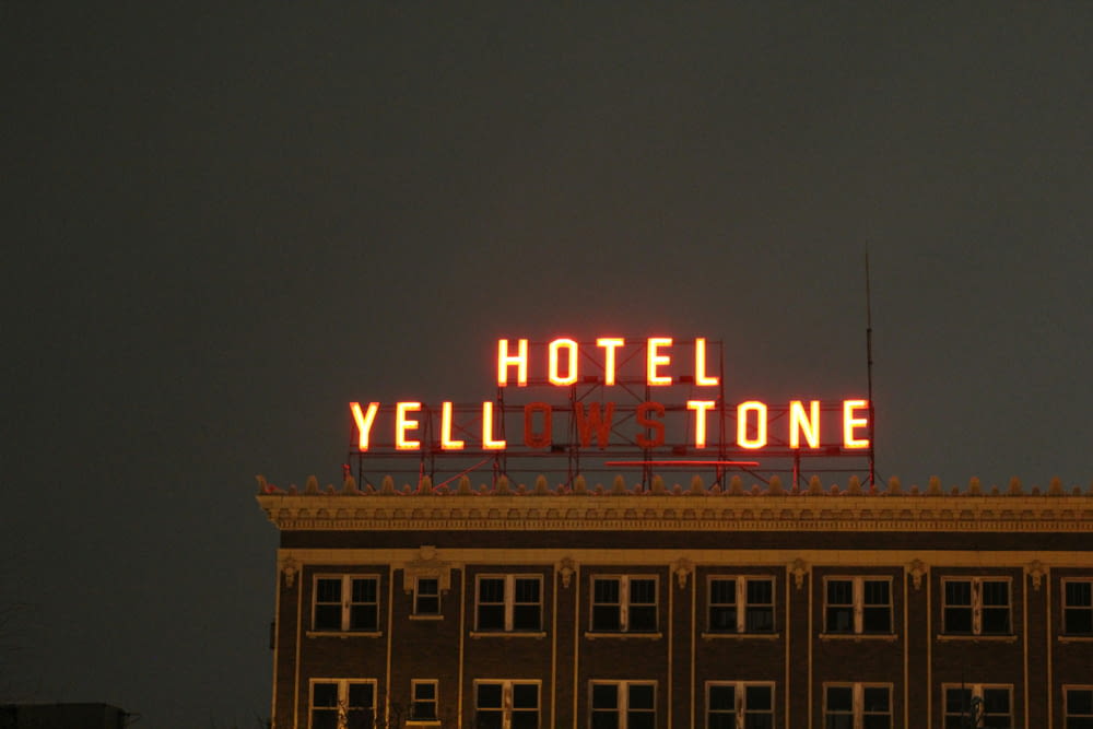a building with a neon sign on top of it