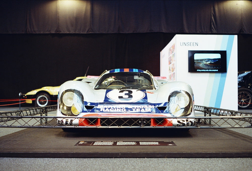 a race car on display in a showroom