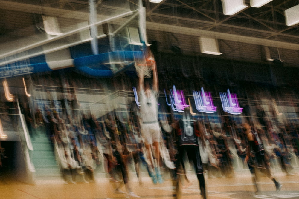 a blurry photo of a basketball game in progress