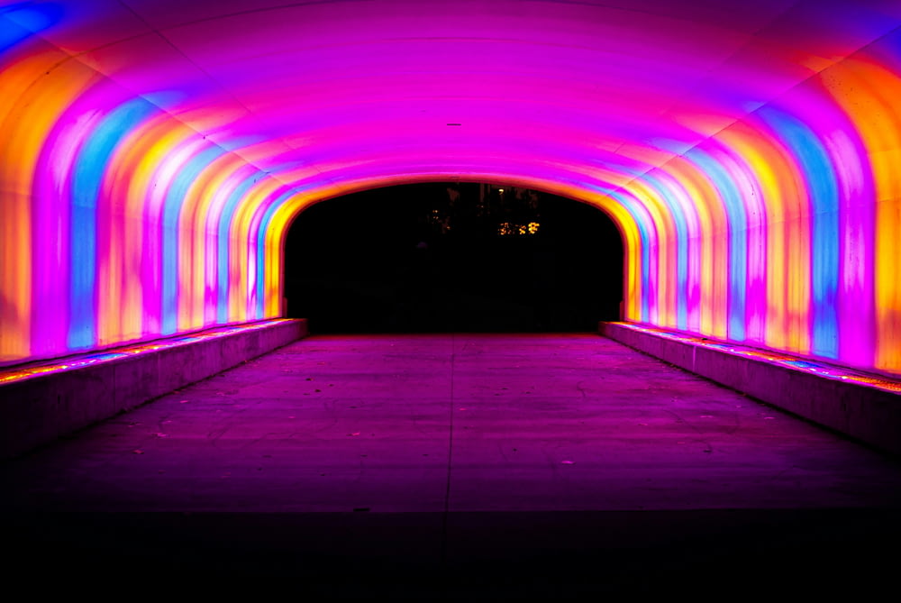 a tunnel that has a lot of lights on it