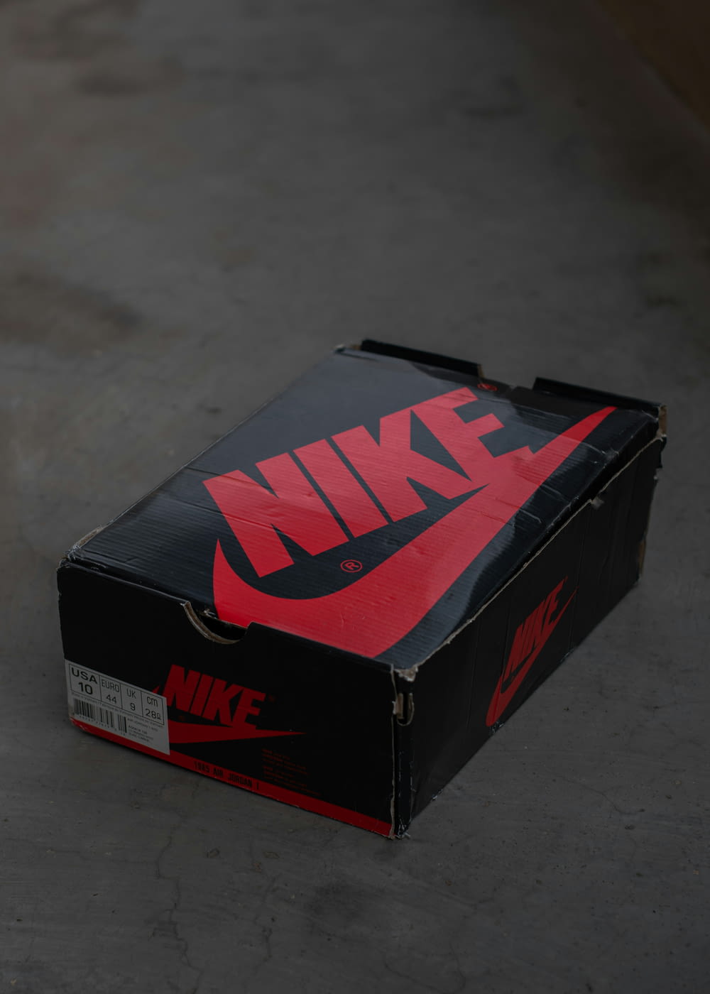 a black box with a red nike logo on it