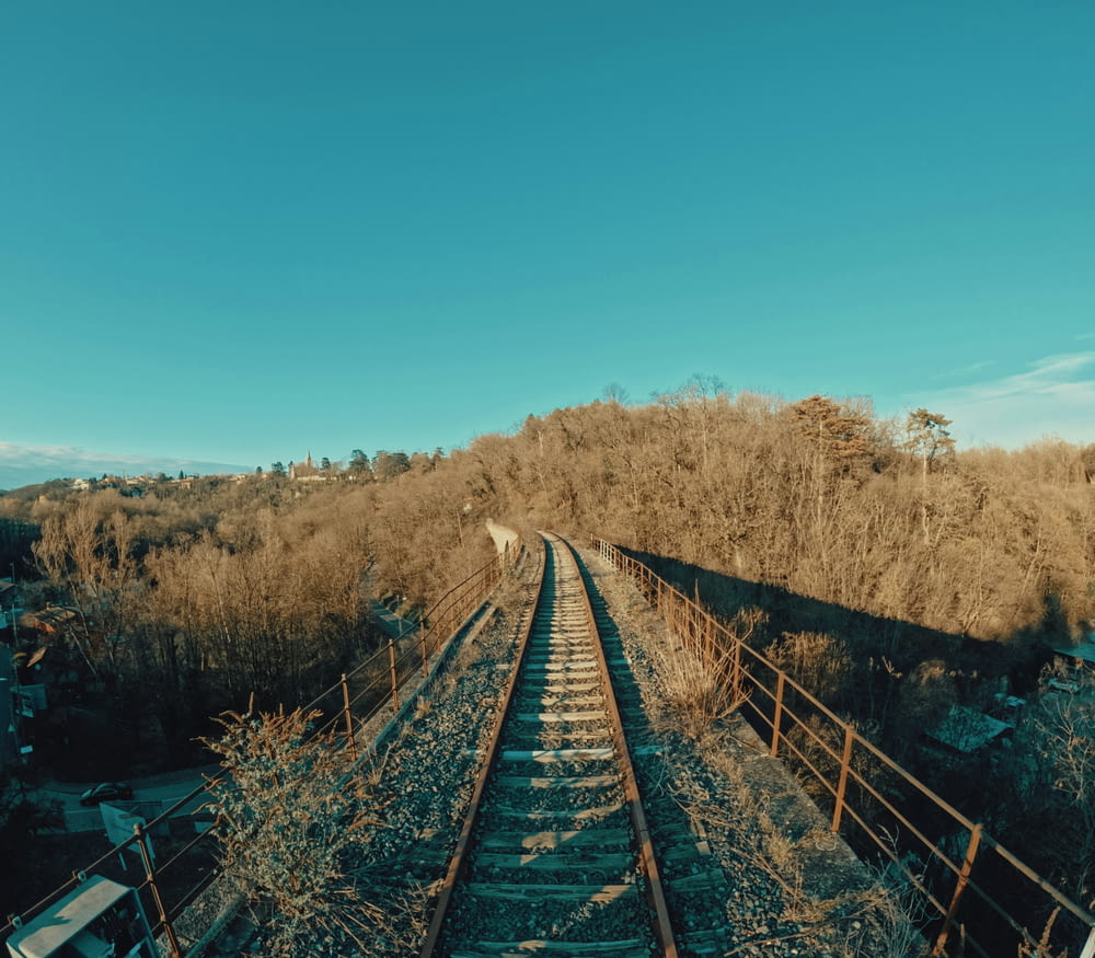 a train track running through a rural area