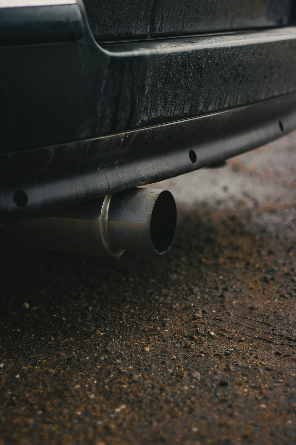 a close up of a car's exhaust pipe