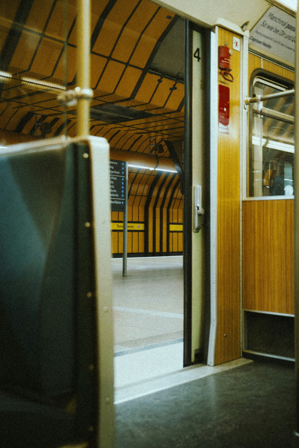 a view of a train's doors from inside the train