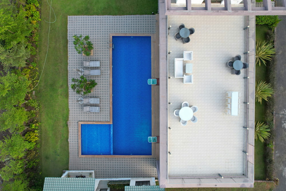 an aerial view of a pool and patio area