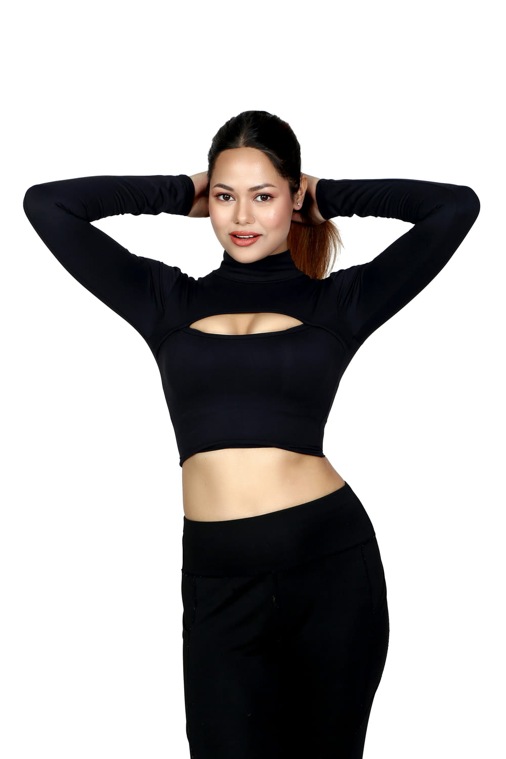 a woman in a black top and black pants