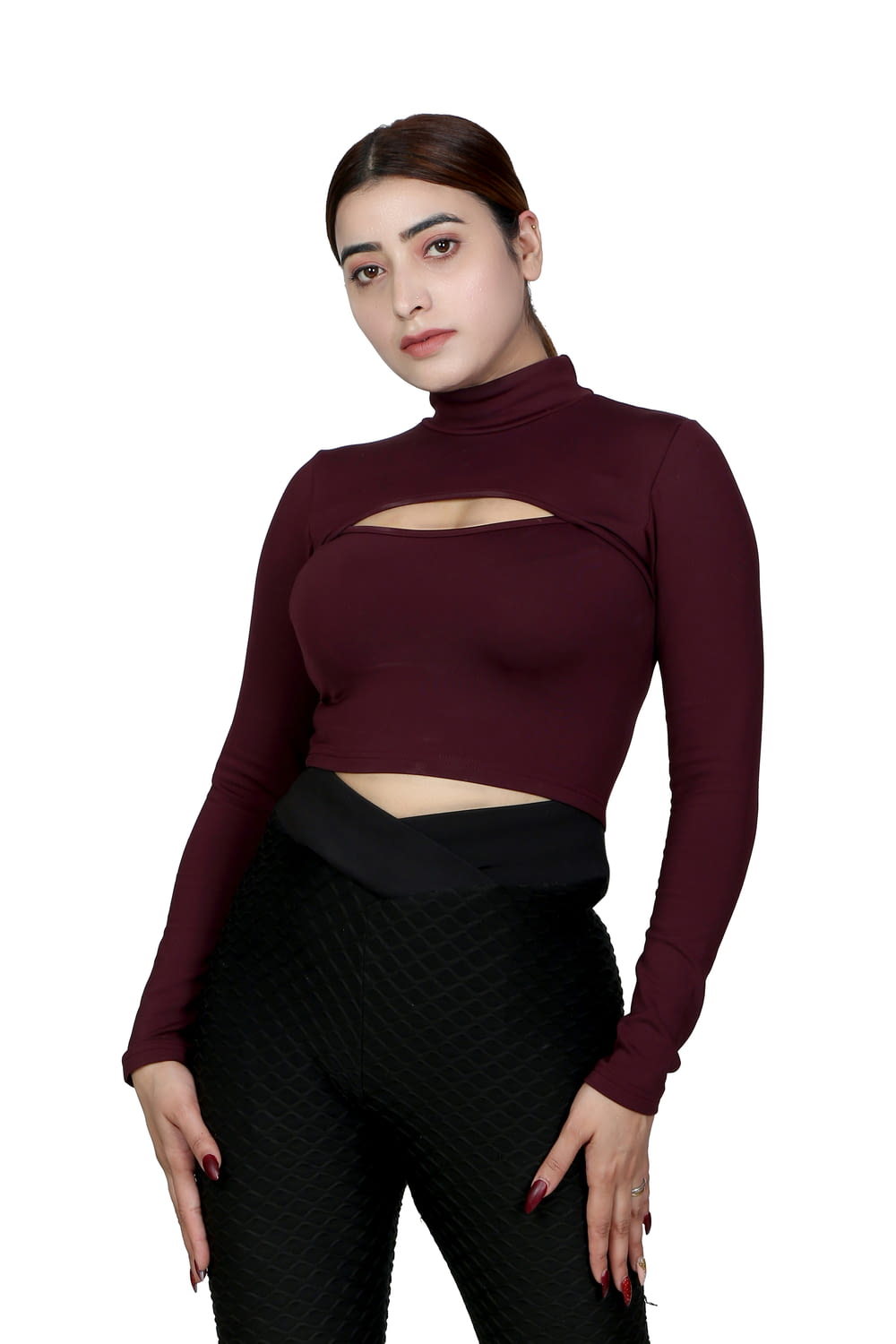 a woman in black pants and a maroon top