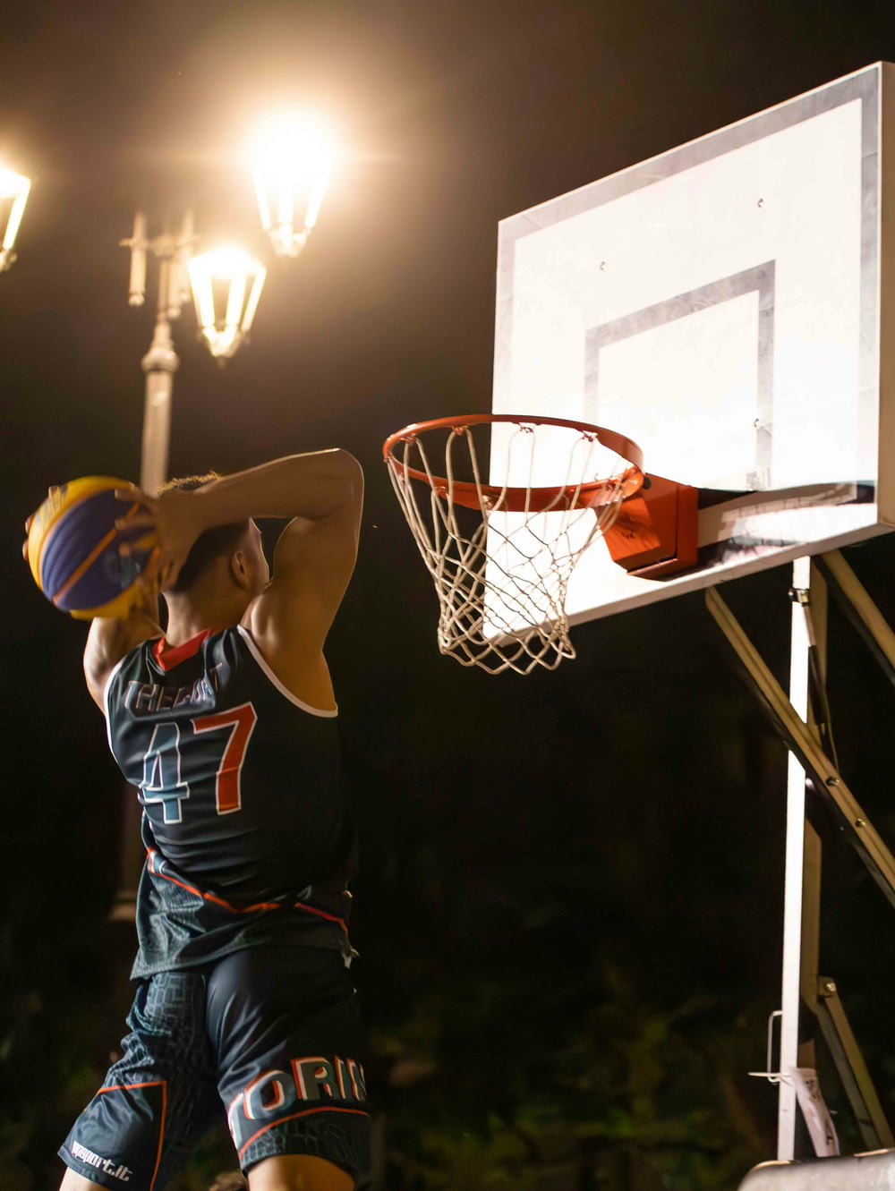 a basketball player is about to dunk the ball
