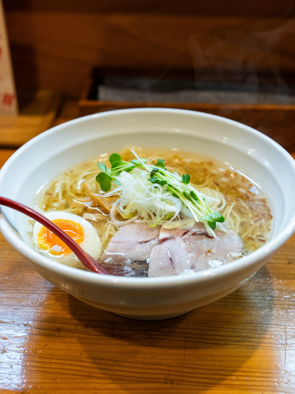 a bowl of ramen with meat and noodles
