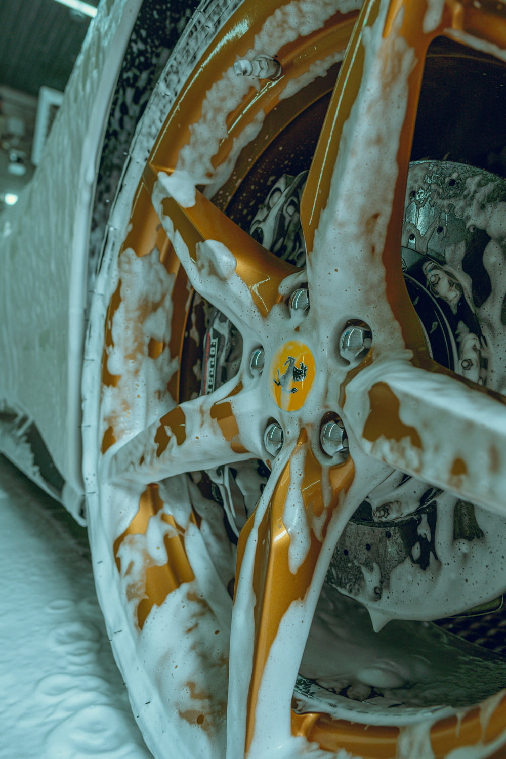a close up of a snow covered car wheel