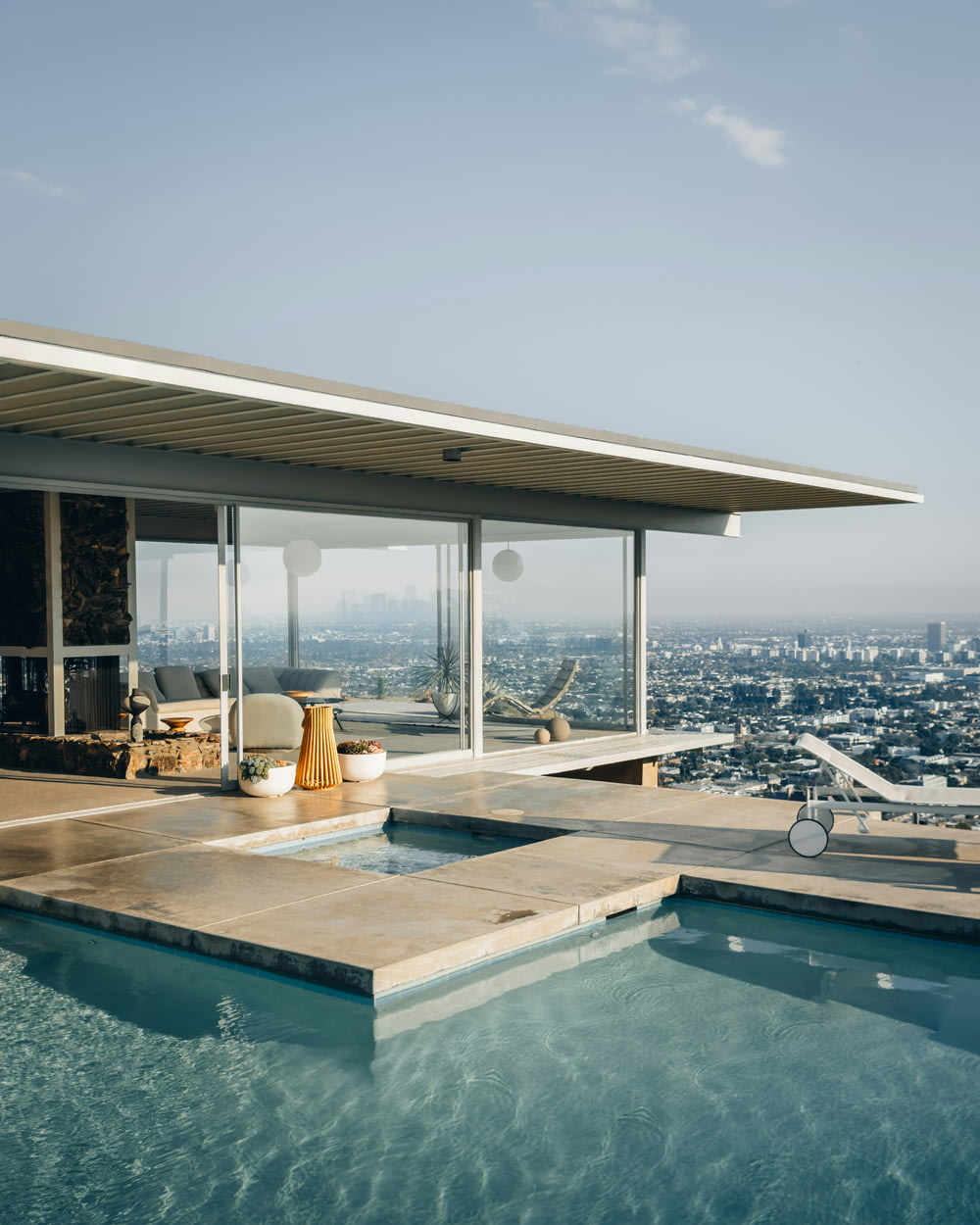 a swimming pool with a view of the city