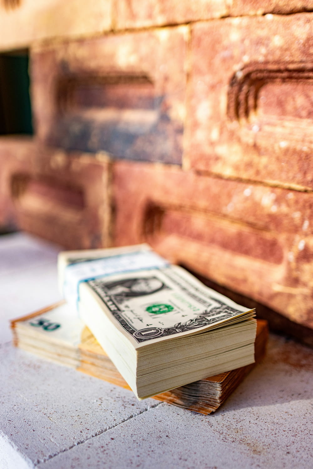a stack of money sitting on top of a table