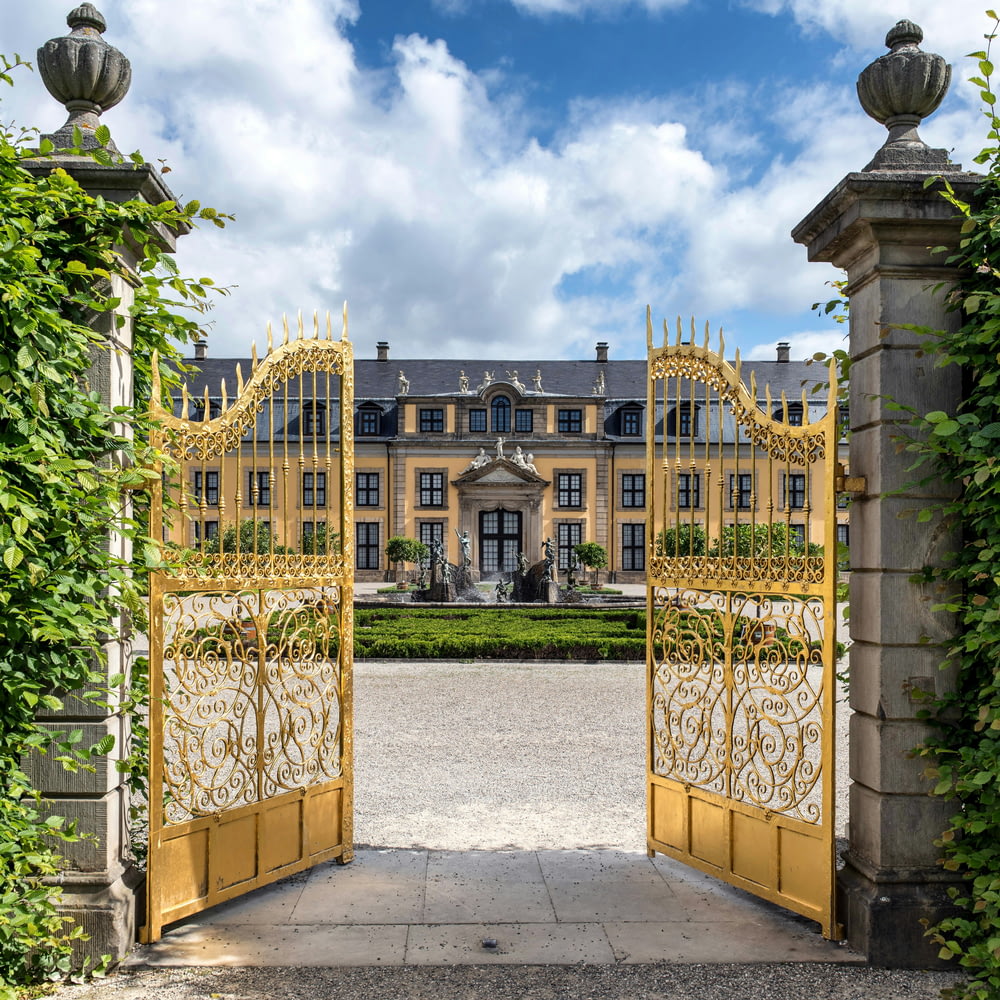 a large building with a large yellow gate in front of it